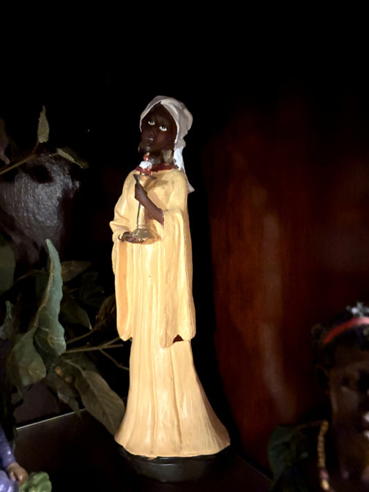 Figurine of a Woman Holding a Candle