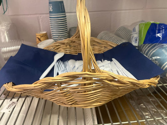 Woven Basket with White Plastic Utensils