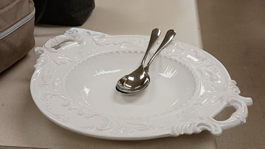 Elegant White Serving Platter with Silver Spoons
