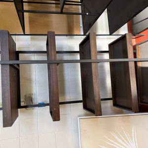 Modern Floating Shelf Unit with Dark Wood and Black Metal Frame