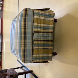 Plaid Upholstered Ottoman with Wooden Bun Feet